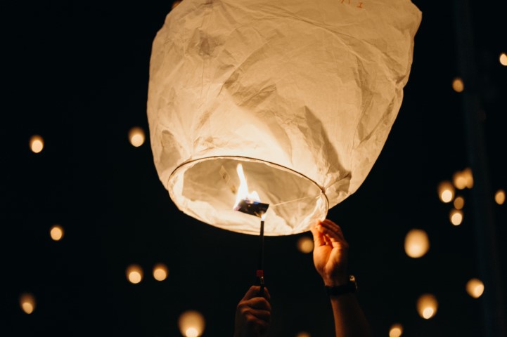 a lantern in the night sky at Chiang Mai Lantern november Festival