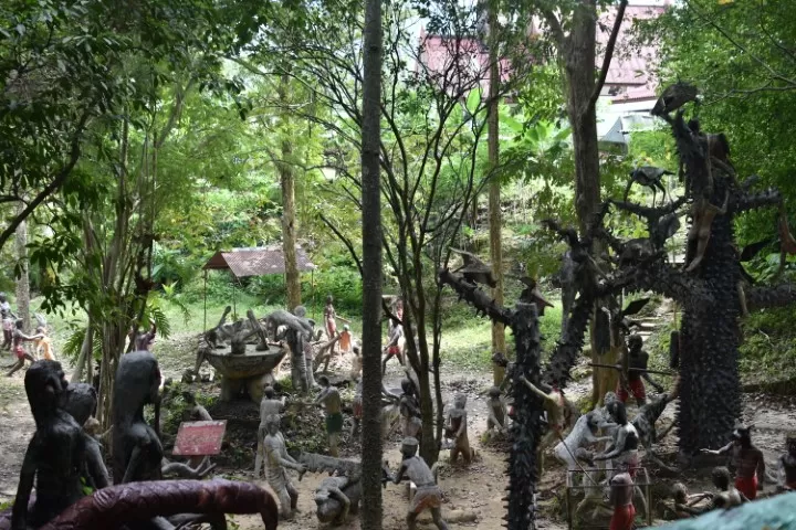 strange and scary statues in a forrest