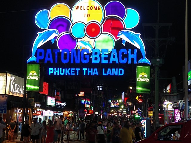 lit up sign at patong beach