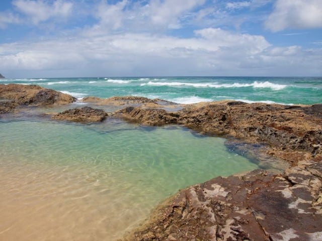 champagne rock pools with the ocean in the background, one of the best fraser island attractions