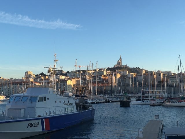 Le Vieux Port (Old Port) of Marseille at dusk with a ship in forefront